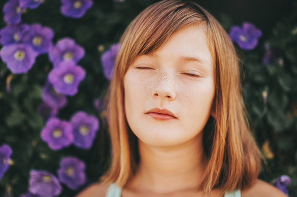 Teenage girl in therapy practicing mindfulness exercises