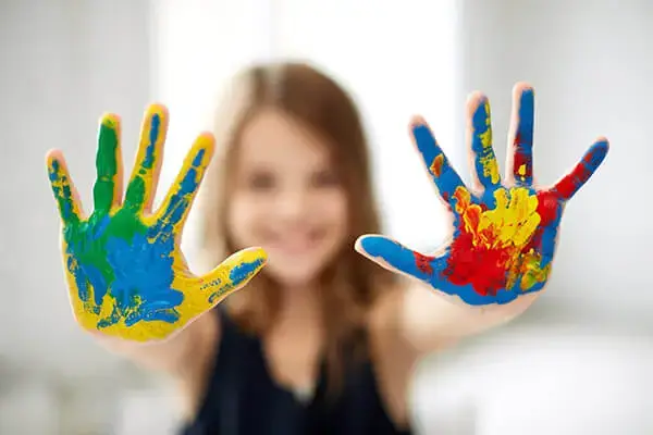 Girl participating in an art therapy session as part of child therapy in Agoura Hills, CA, illustrating the creative and expressive techniques used to help children heal and grow