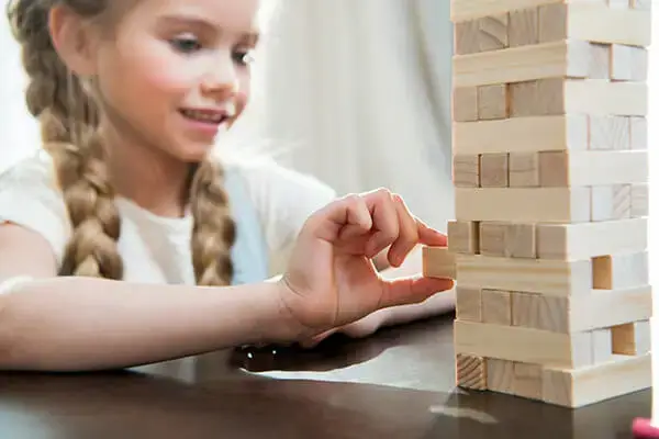 Child engaged in a therapeutic game during play therapy session in Agoura Hills, CA, demonstrating effective techniques used in child therapy