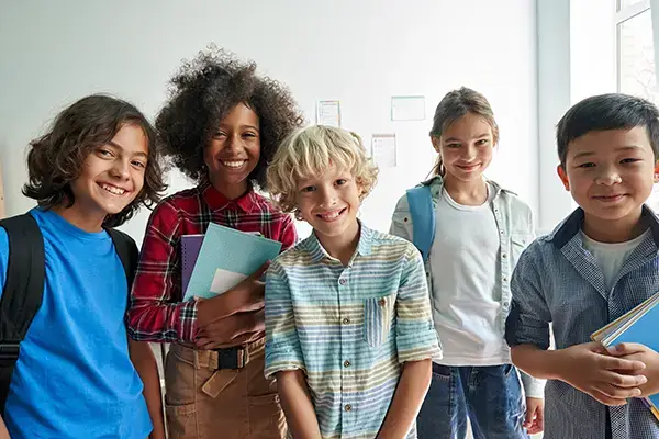 Group of happy children at school in Westlake Village, CA, representing the positive outcomes of child therapy program with Julie Kalmon, LMFT