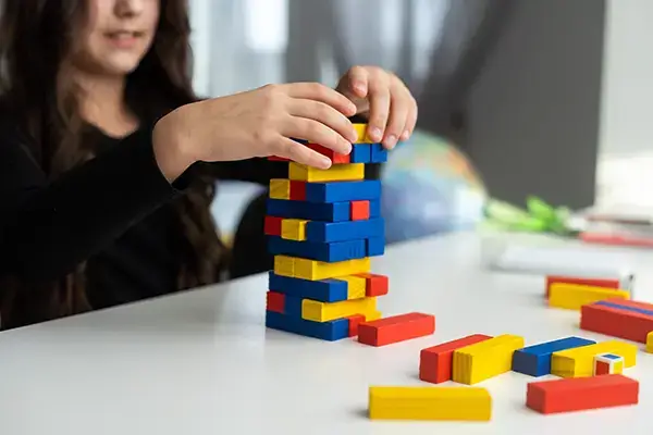 Child engaged in a therapeutic game during a play therapy session in Westlake Village, CA, illustrating the effective techniques used in child therapy