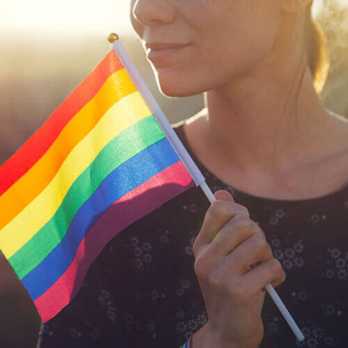 teen holding a pride flag